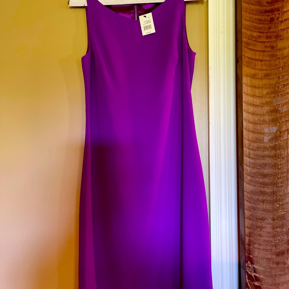 Purple dress, slim fit, size 2. Never been worn. New with tags. Smoke free home